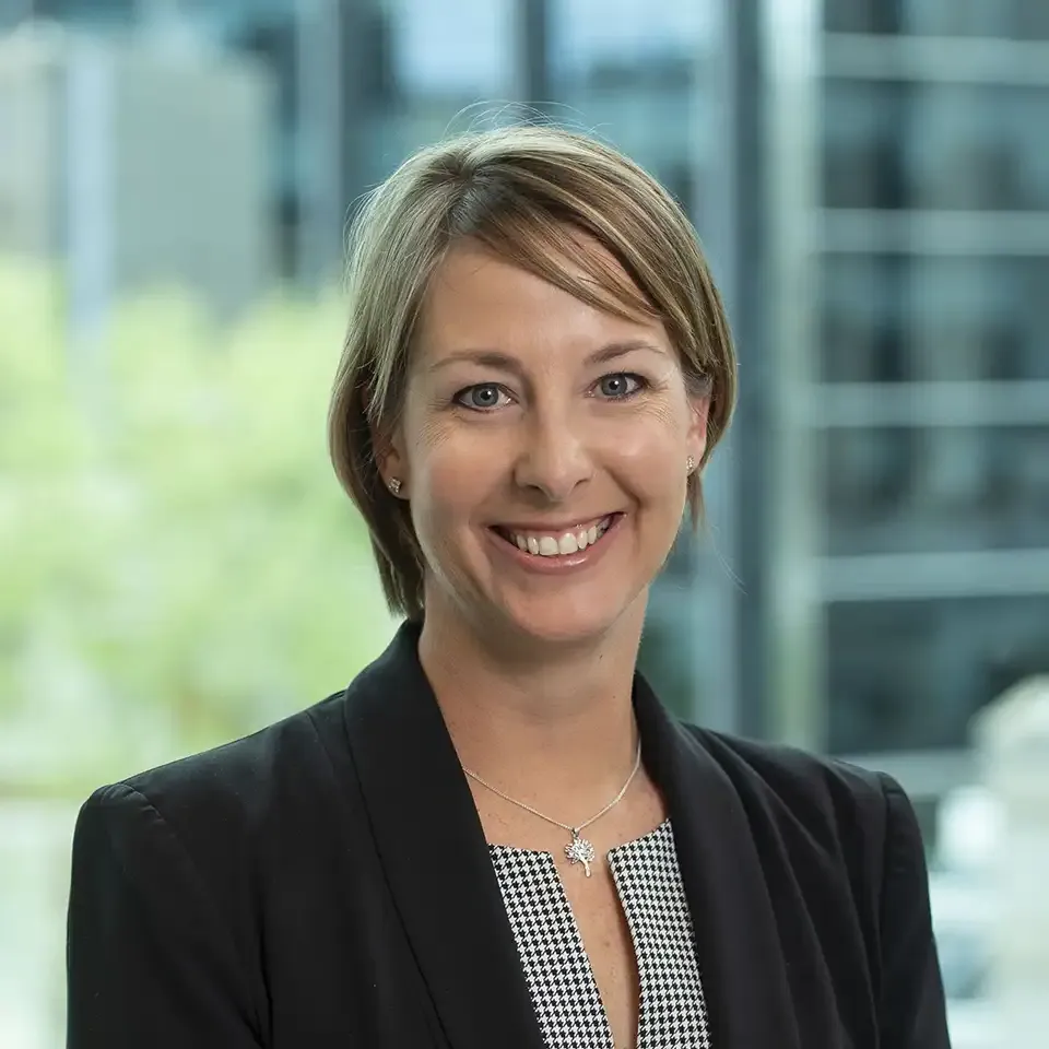 Headshot of Gayle Bowness smiling in business attire